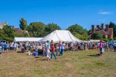 Marquee and people at village event